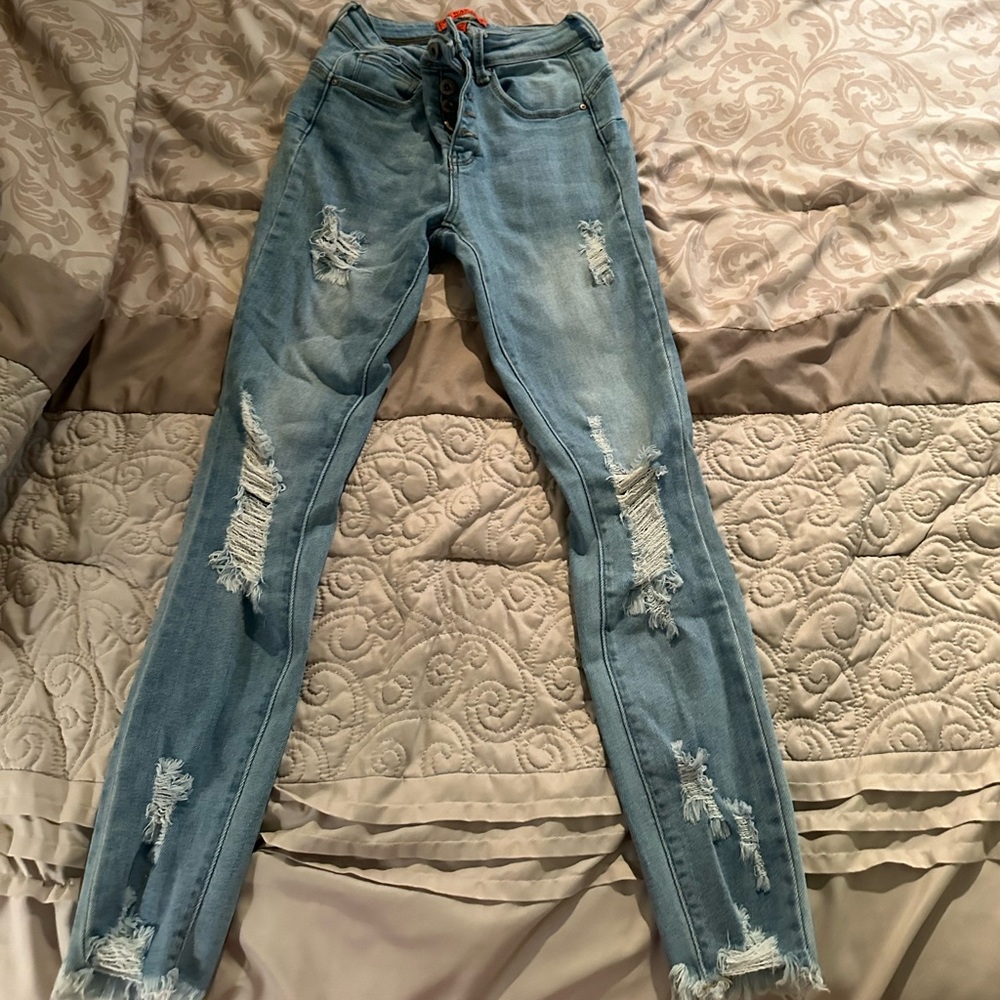 Light blue ripped jeans
